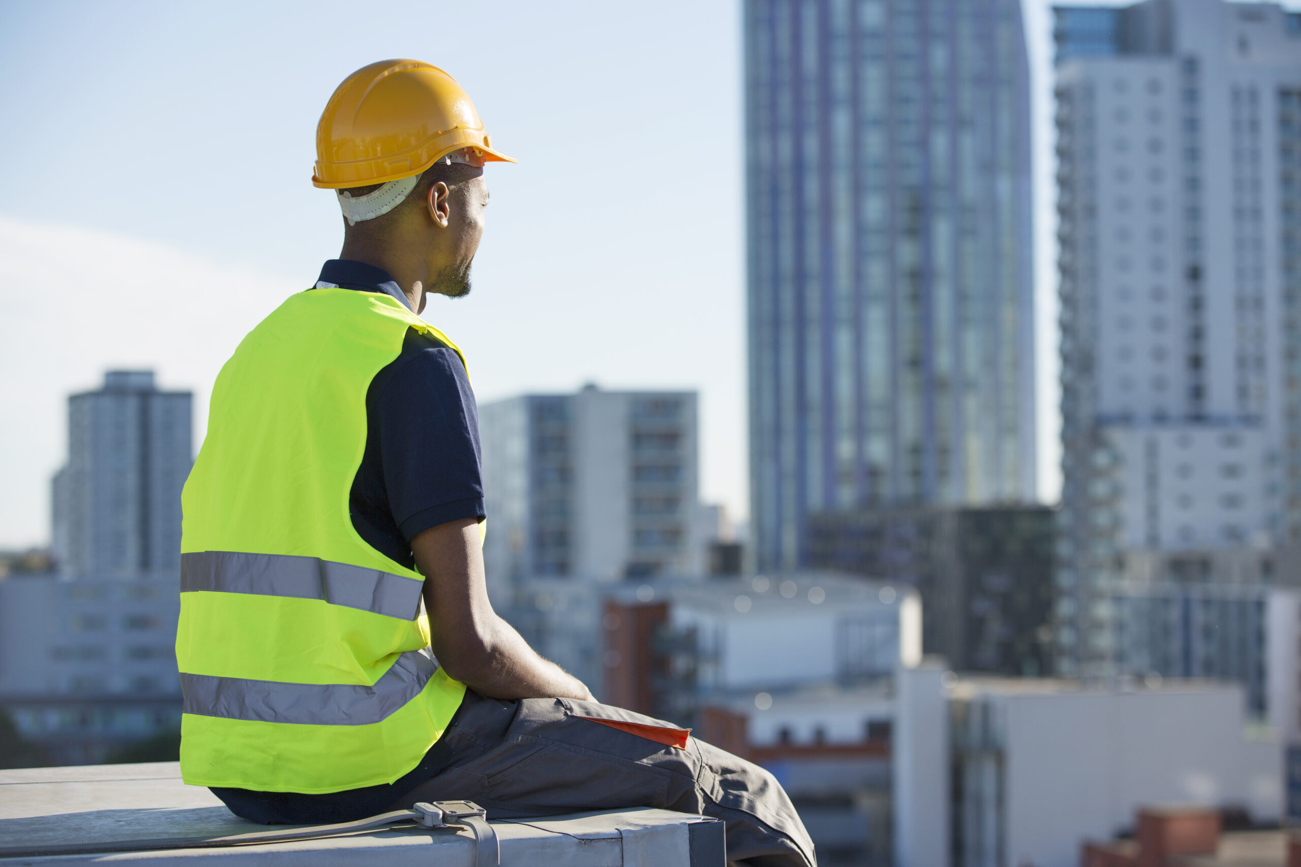construction worker sitting on ledge outdoors ta 2022 03 04 01 51 50 utc scaled